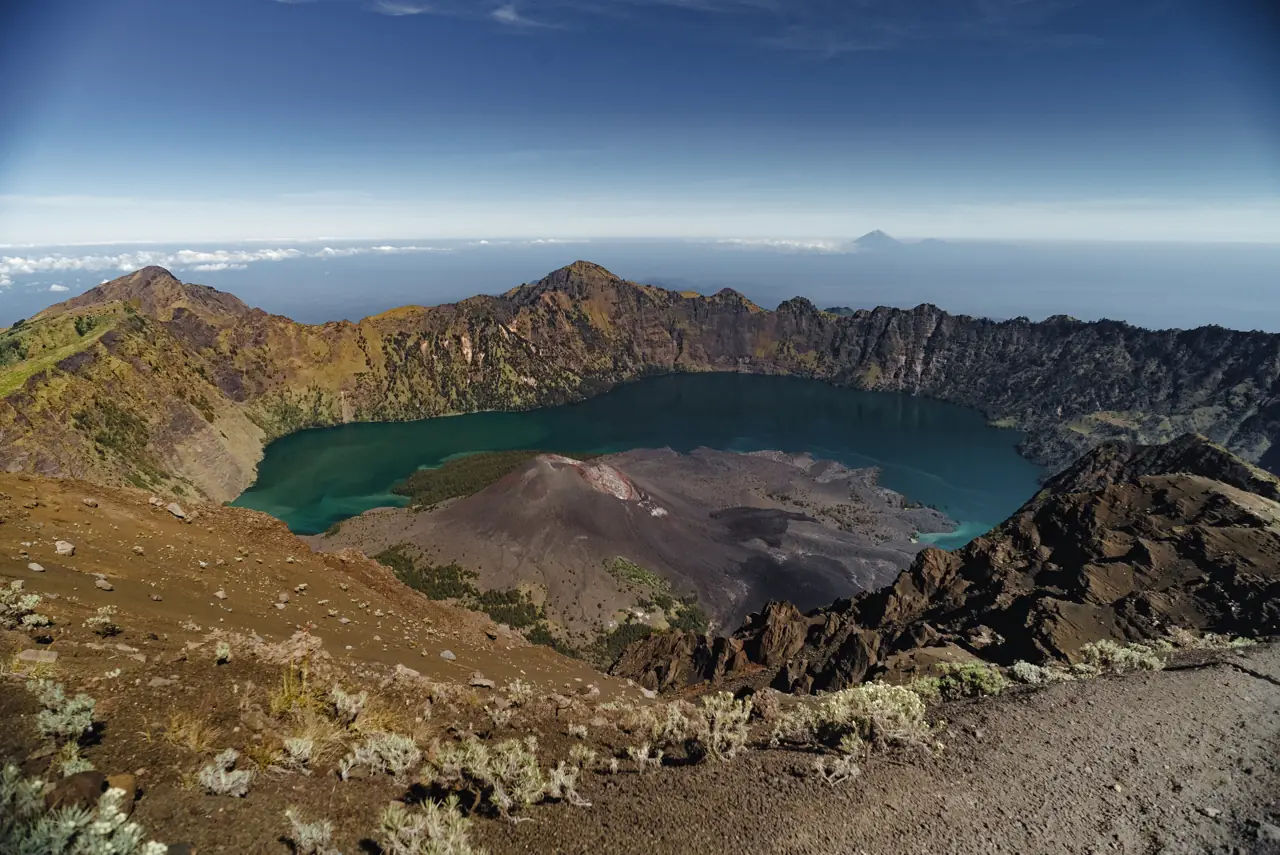 Rinjani's crater lake seen from the summit, with the small new volcano in the middle